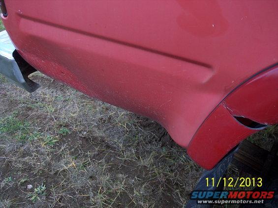 1991 Toyota Pickup/SR5 rear fender and bumper, red paint with some scuffs
