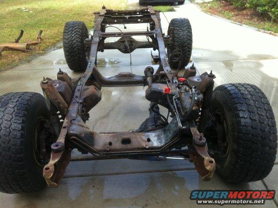 Vehicle frame with suspension and tires, no body panels visible