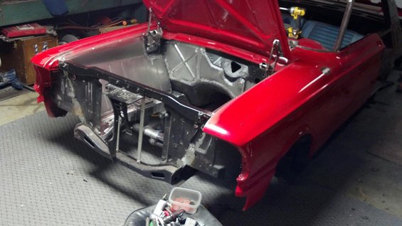 1964 Ford Fairlane body with hood open, showing engine bay structure