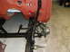 1964 Ford Fairlane - Close-up view of the front suspension and chassis of a vehicle in a workshop, possibly during a restoration project.