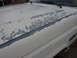 1991 Ford F-350 - The paint on this truck's hood is severely weathered, revealing the primer below.