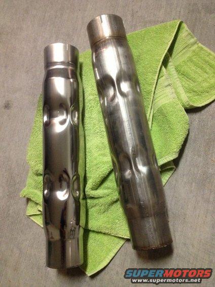 Two exhaust pipes on a green towel; one polished, one raw