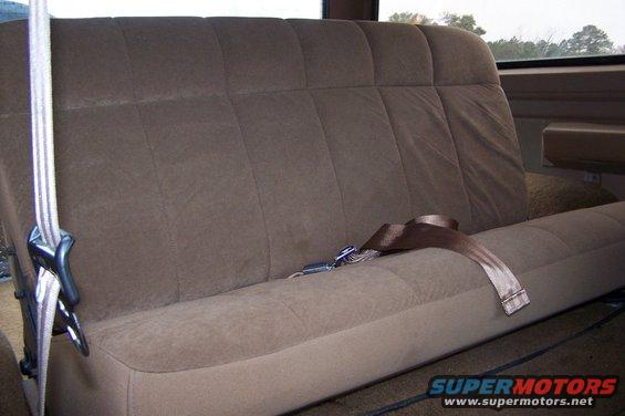 Brown fabric rear bench seat with seatbelts