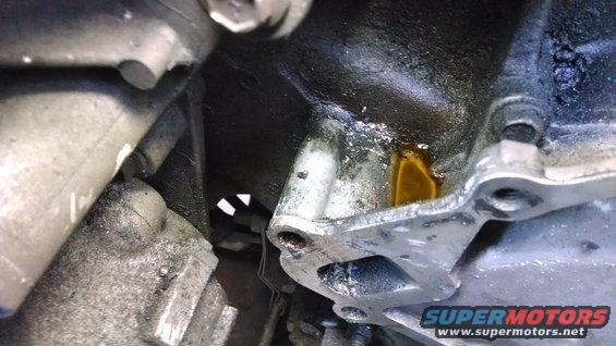Engine part with oil leak