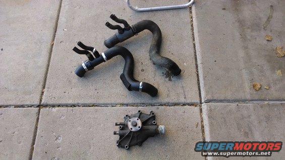 Engine water pump and hoses on concrete
