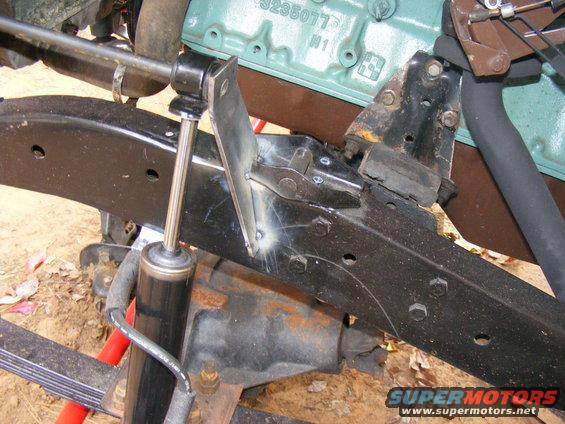 Shock absorber and custom frame bracket on a vehicle chassis