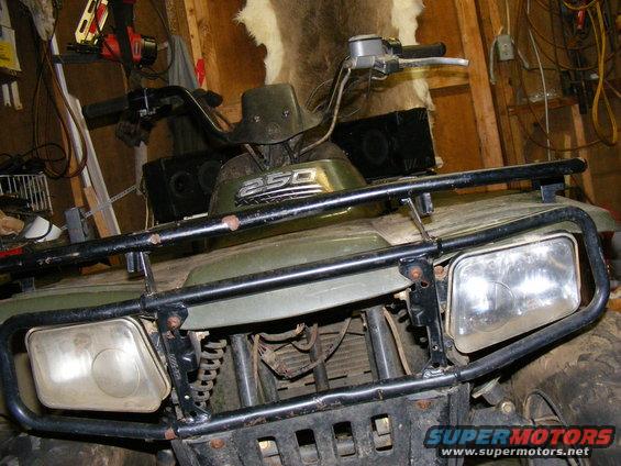 Green ATV with "250" badge on front