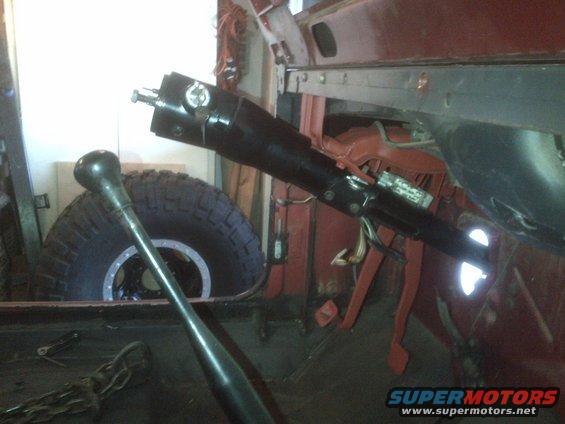 Steering column and gear shift lever inside a vehicle