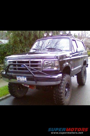 1995 Ford Bronco with aftermarket grille guard and roof lights