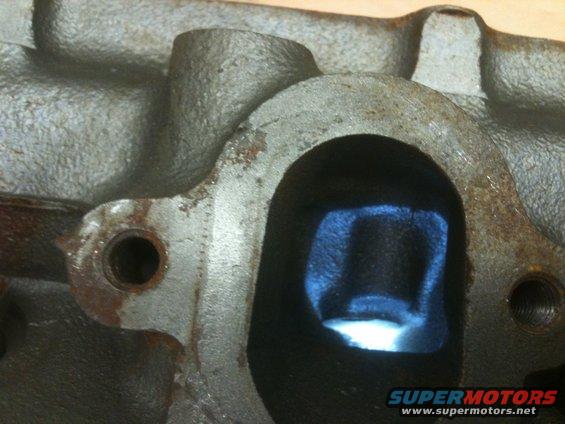 You can see the smog bump in a exhaust port in this picture. 