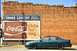 1993 Ford Taurus - A 1993 Ford Taurus is parked next to a vintage brick building a Corner Grocery and Coca-Cola advertisement.