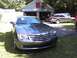 2004 Chrysler Crossfire - A gray Chrysler Crossfire is parked in front of a garage with another vehicle visible in the background.