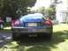 2004 Chrysler Crossfire - Rear view of a 2004 Chrysler Crossfire coupe, dual exhaust pipes and a yellow license plate.