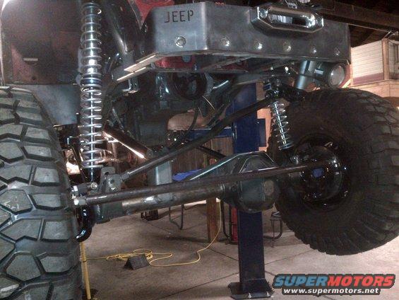 Jeep rear axle, suspension, and winch assembly. The word JEEP is visible on a metal plate