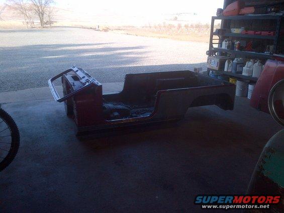 Red Jeep CJ body shell, side view