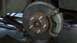 1996 Ford Taurus - Close-up of a vehicle's front brake rotor and caliper, indicating a need for maintenance.