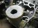 1900 Honda Big Red - Close-up of a disassembled engine cylinder and piston, showing internal components.