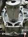 1900 Honda Big Red - This image shows a close-up view of an engine's cylinder and piston, with visible wear and debris.