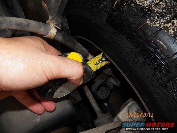 Measuring tire clearance with a tape measure