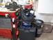 2004 Aston Martin Virage - A collection of tools and equipment is organized in a garage setting.