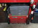 2004 Aston Martin Virage - Two toolboxes, one red and one gray, are stacked on top of each other in a workshop setting.