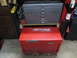 2004 Aston Martin Virage - Red and gray toolboxes are stacked in a workshop setting.