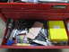 2004 Aston Martin Virage - A red toolbox drawer is open, revealing a collection of automotive tools and a yellow case with handwritten labels.