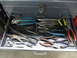2004 Aston Martin Virage - A variety of hand tools, primarily pliers, are organized in an open toolbox drawer.