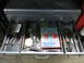 2004 Aston Martin Virage - A collection of tools organized within the drawers of a metal toolbox.