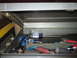 2004 Aston Martin Virage - A view inside a metal toolbox reveals an assortment of screwdrivers and other hand tools.