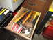 2004 Aston Martin Virage - A drawer is filled with various hammers and tools, with a red and white box visible.
