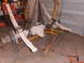 1988 Ford F-250 - Front axle assembly with leaf springs being lifted by an engine hoist in a garage setting.