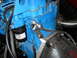 1992 Ford Bronco - Engine component detail showing a blue block, filter, and braided hose.