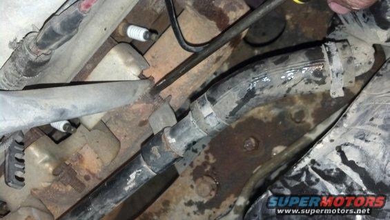 close-up of engine hoses and spark plugs
