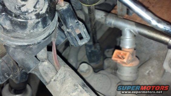 Close-up of a fuel injector and associated engine components