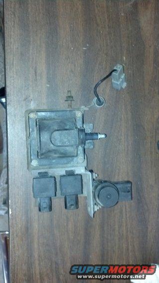 Ignition coil pack with wiring harness connector on a wooden surface