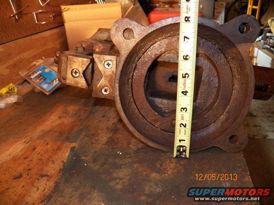 Bench vise with a tape measure on it. A box of Ideal wire connectors is nearby