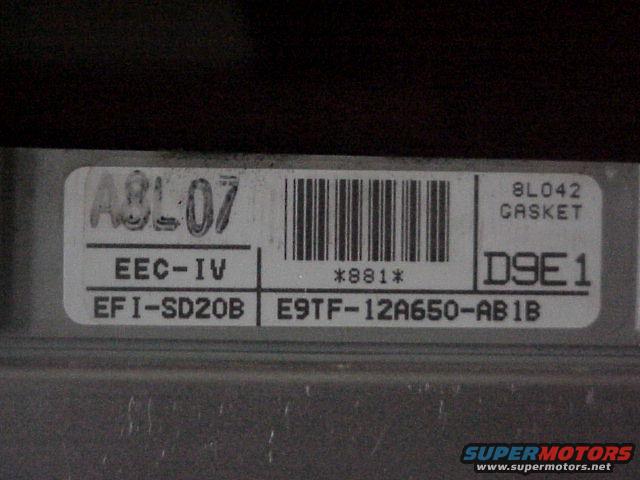 Label on an engine control unit with text EEC-IV, EFI-SD20B, E9TF-12A650-AB1B, and 8L042 GASKET