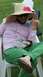 1995 Ford Bronco - Man in a large straw hat and green pants sits outdoors on a sunny day.