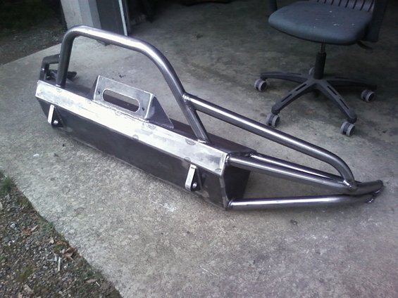 Custom steel bumper with brush guard and winch cutout, unpainted