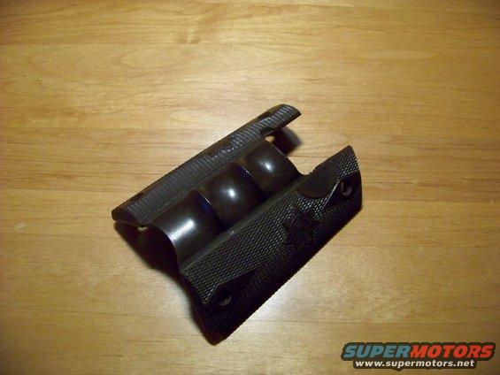 Black gun grip with textured sides and three rounded finger grooves