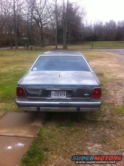 Rear view of a gray 1991 Ford Crown Victoria LTD with an Arkansas license plate