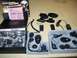 2001 BMW R1150GS ABS - Cardo Scala Rider MultiSet Q2 motorcycle communication system components laid out for display.