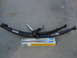 1988 Ford Bronco - New suspension parts, including leaf springs and shock absorbers, are displayed on the ground.