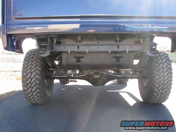 Blue SUV rear axle, suspension, and large tires