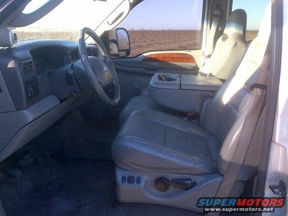Gray leather seats and dashboard of a truck, viewed from the passenger side