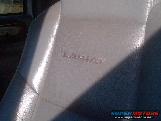 Gray leather seat with embossed Lariat badging