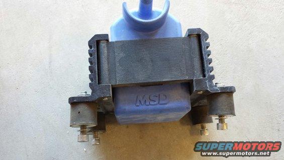 Blue MSD ignition coil with black housing and mounting hardware