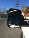 1997 Dodge 3500 - Side mirror shows reflection of a white vehicle and street scene with other cars.