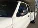 1997 Dodge 3500 - This white pickup truck appears to be from the late 1990s, with a camper shell mounted in the bed.
